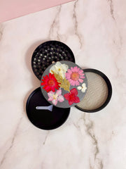 grinder covered in flowers